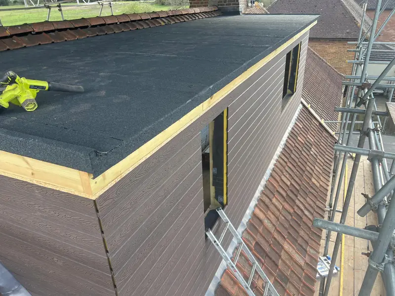 New felt flat roof on a dormer, with timber edging and cladding