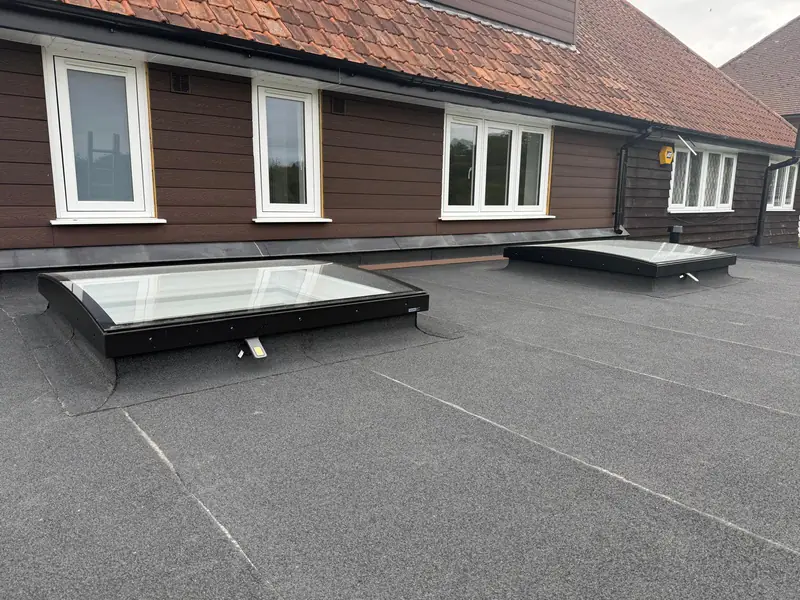 New felt flat roof on a rear extension with two roof lights
