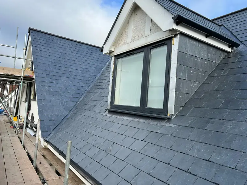 Finished slate roof around a new dormer window